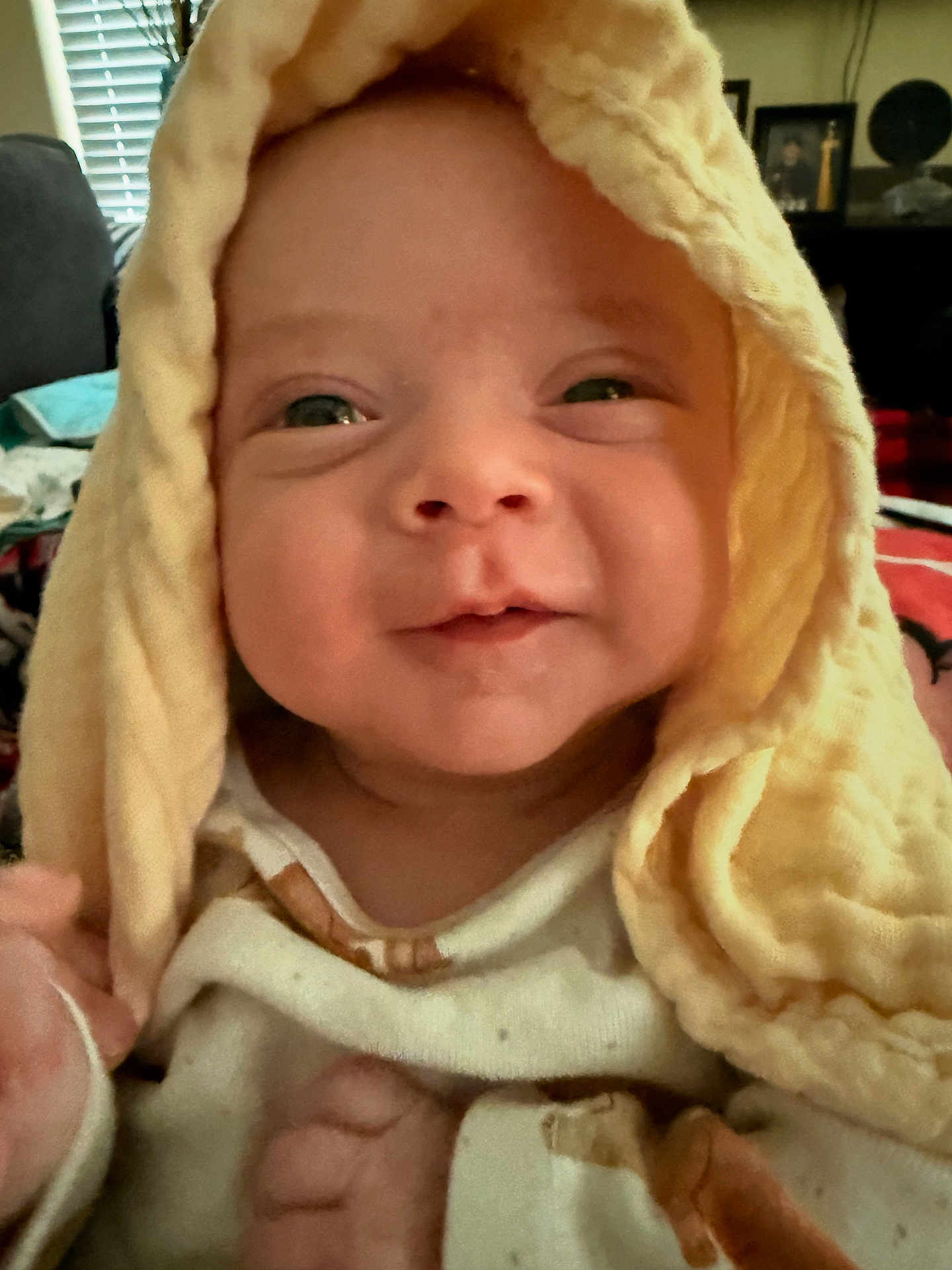 Daxton joined the competition — help win amazing prizes! baby, infant, smiling, face, blanket, yellow, soft, indoors, cute, child, closeup, warm, happy, clothing, person, newborn, cozy, expression, toddler, portrait