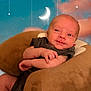 baby, infant, cushion, plush, face, smile, expression, background, moon, stars, night, soft, comfortable, newborn, person, portrait, cute, indoors, resting, clothing