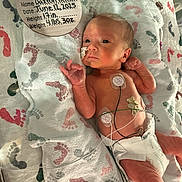 Daxton joined the competition — help win amazing prizes! newborn, baby, hospital, blanket, footprints, medical_electrodes, diaper, infant, crib, healthcare, face, skin, resting, small, cute, person, lying_down, monitoring, hospital_bed, wrapped