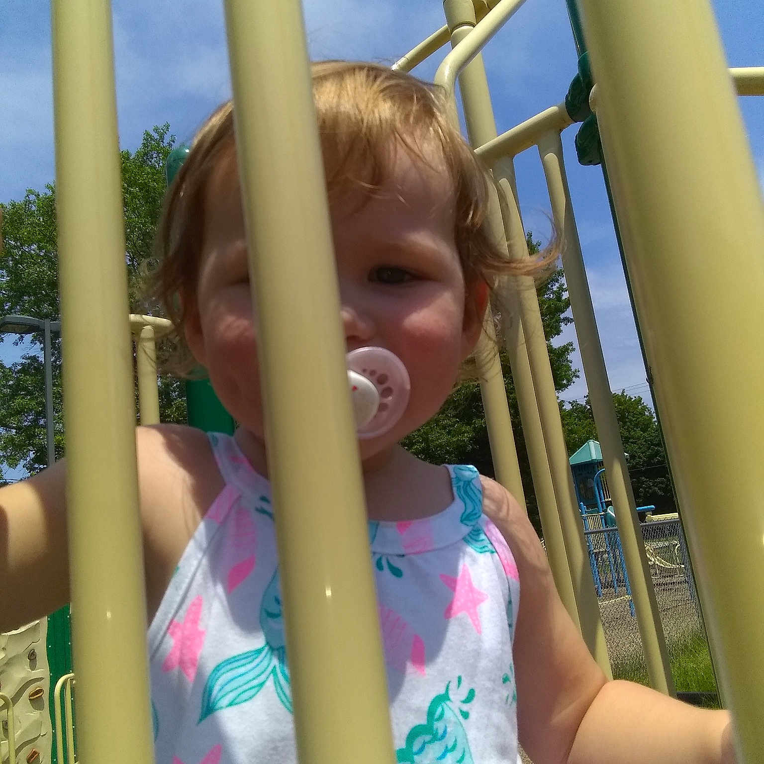 Sawyer is registered to the contest to win money with this photo: child, city, eye, fun, human_settlement, leisure, outdoor_play_equipment, park, play, playground, playground_slide, public_space, recreation, smile, summer, toddler, vacation