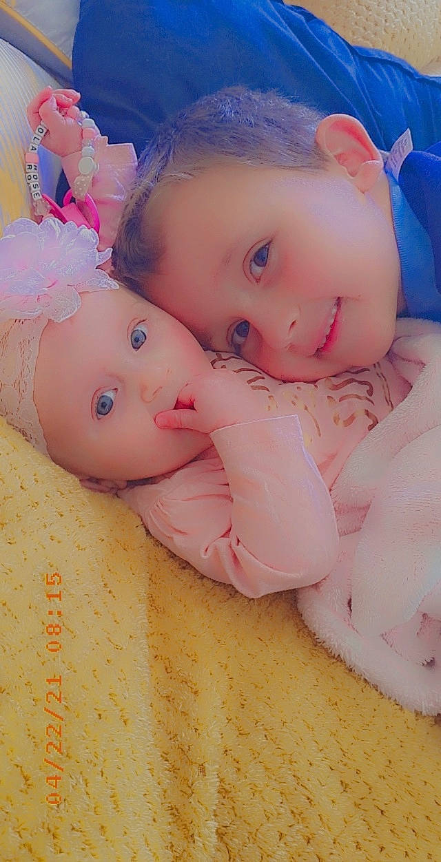 Lola-rose is registered to the contest to win money with this photo: baby, baby_products, baby_toddler_clothing, baby_toys, cheek, child, doll, face, finger, foot, happy, nail, nose, pattern, peach, person, pink, skin, stuffed_toy, toddler