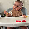 Jackson joined the competition — help win amazing prizes! baby, high_chair, bib, snack, watermelon, food, messy, child, indoor, person, cute, smile, face, hand, seat, clothing, table, furniture, home, eating