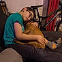 Stephane participe au concours pour gagner de l'argent avec cette photo : affection, bicycle, boy, casual_clothing, child, comfort, couch, dog, floor, friendship, furniture, glasses, home, hugging, indoor, pet, red_curtain, relaxation, socks, wall