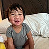 Naniko joined the competition — help win amazing prizes! baby, bed, child, cozy, cute, face, gray_clothing, hair, hand, happy, indoors, infant, person, pillow, portrait, sitting, skin, smiling, toddler, young