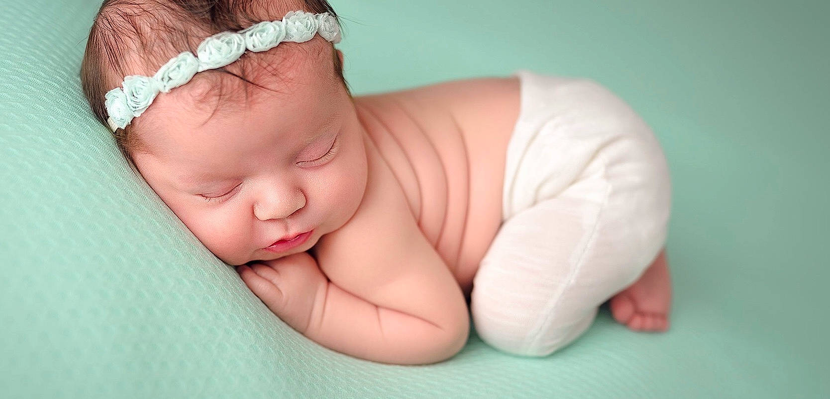 Arizona is registered to the contest to win money with this photo: arm, baby, baby_sleeping, birth, cheek, child, ear, fashion_accessory, hair_accessory, hand, headband, headgear, headpiece, headwear, person, photography, pink, skin, toddler, tummy_time