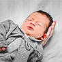 Timéo participe au concours pour gagner de l'argent avec cette photo : baby, newborn, sleeping, hand, knitted_sweater, cozy, peaceful, infant, portrait, soft_background, gentle, cute, resting, child, warmth, skin, face, small_hands, closeup, comfort