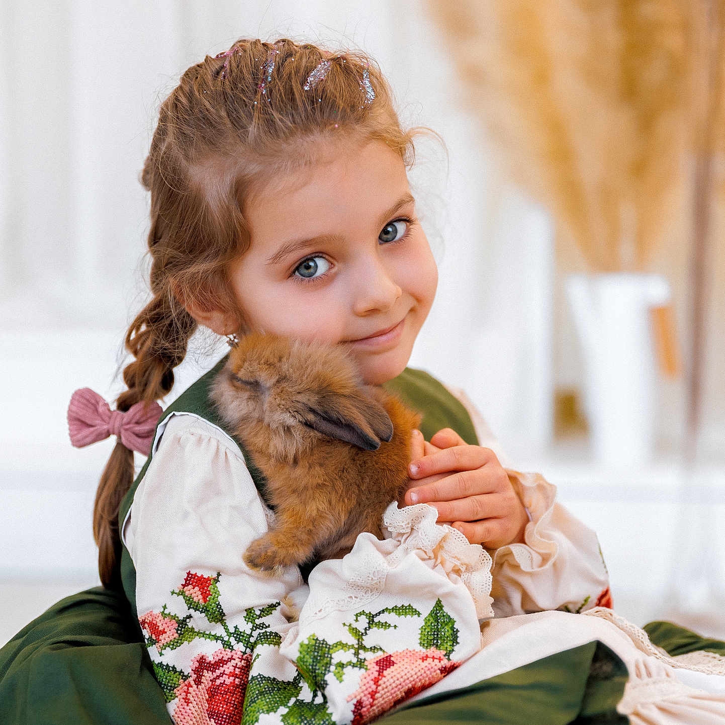 Uliana is registered to the contest to win money with this photo: adorable, animal, braid, child, cozy, cute, dress, embroidery, fluffy, girl, glitter, green, holding, indoors, pet, portrait, rabbit, smile, soft, white