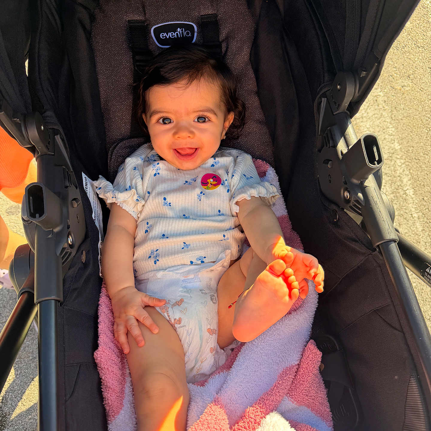 Nalianna is registered to the contest to win money with this photo: baby, blanket, child, clothing, cute, diaper, foot, hand, happy, infant, outdoor, person, pink, playful, portrait, seat, smiling, stroller, sunlight, white