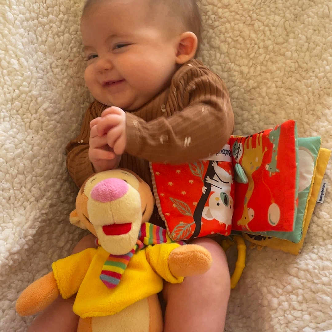 Lily-Honora participe au concours pour gagner de l'argent avec cette photo : baby, blanket, child, clothing, colorful, cozy, cute, fabric_book, foot, happy, indoors, infant, person, playtime, portrait, relaxing, smiling, soft, stuffed_animal, toy
