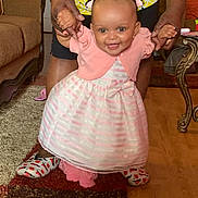 Kodi is registered to the contest to win money with this photo: architecture, baby, building, clothing, couch, cushion, dress, face, footwear, furniture, head, homedecor, indoors, livingroom, person, photography, portrait, shoe, sitting, wood