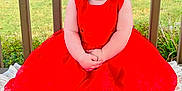 Adalynn joined the competition — help win amazing prizes! baby, child, smile, red_dress, flower_crown, outdoor, garden, blanket, happy, portrait, sitting, cute, young_child, nature, greenery, headband, hands, face, cheerful, daylight