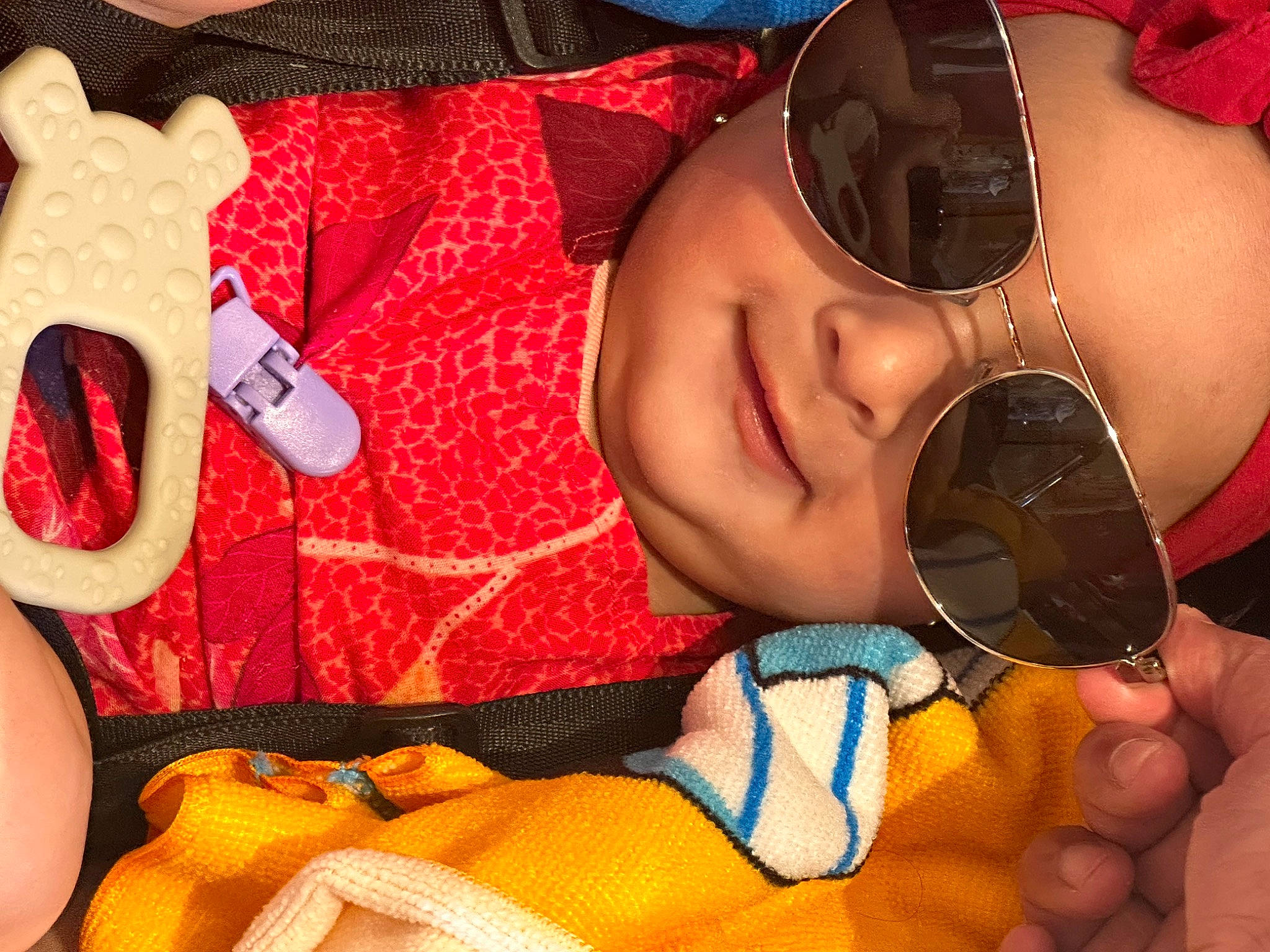Amber joined the competition — help win amazing prizes! baby_toddler_clothing, child, cool, eyewear, facial_expression, finger, goggles, hair, hand, happy, head, headgear, headwear, lip, mouth, orange, person, product, smile, sunglasses