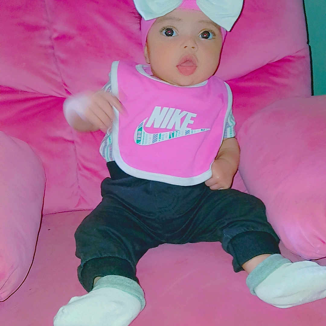 Clover is registered to the contest to win money with this photo: armchair, baby, cap, chair, clothing, couch, cushion, face, furniture, hat, head, homedecor, hosiery, pants, person, photography, portrait, sitting, sock, toy