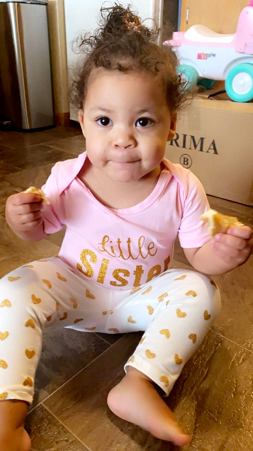 Ariana joined the competition — help win amazing prizes! baby, baby_toddler_clothing, cheek, child, facial_expression, fun, hair, hairstyle, happy, head, neck, nose, orange, person, pink, skin, sleeve, t_shirt, thigh, toddler