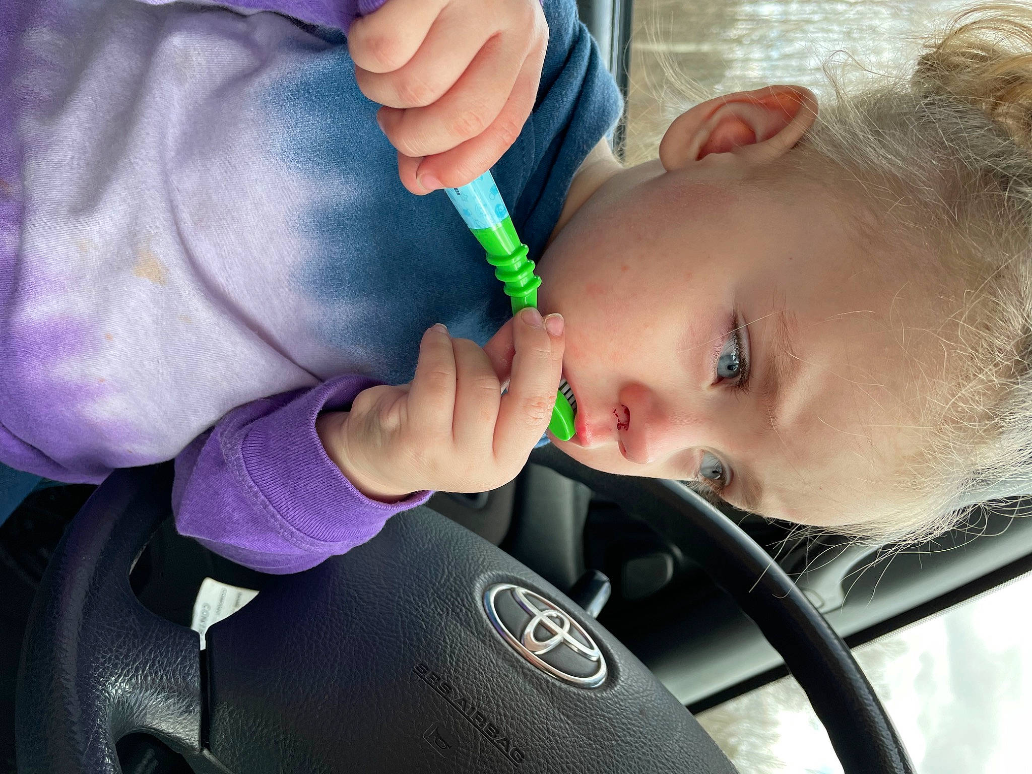 Amyah is registered to the contest to win money with this photo: arm, baby, baby_products, cheek, child, eyelash, finger, gesture, hand, happy, human_body, lip, mouth, nail, nose, person, skin, steering_wheel, thumb, toddler