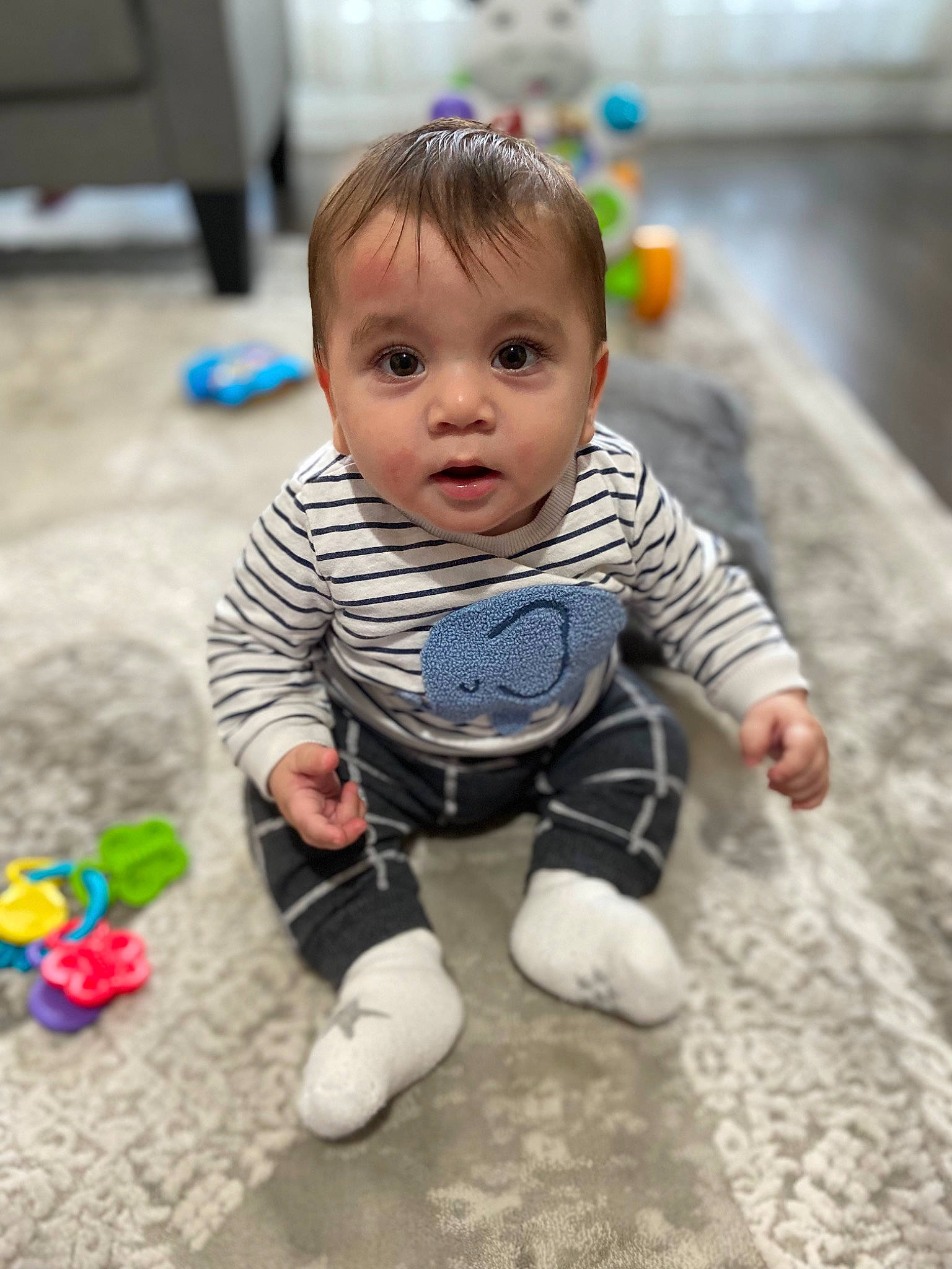 Berkay participe au concours pour gagner de l'argent avec cette photo : baby, baby_playing_with_toys, baby_products, baby_toddler_clothing, cheek, child, floor, flooring, foot, fun, happy, leisure, person, play, sitting, skin, smile, standing, toddler, toy