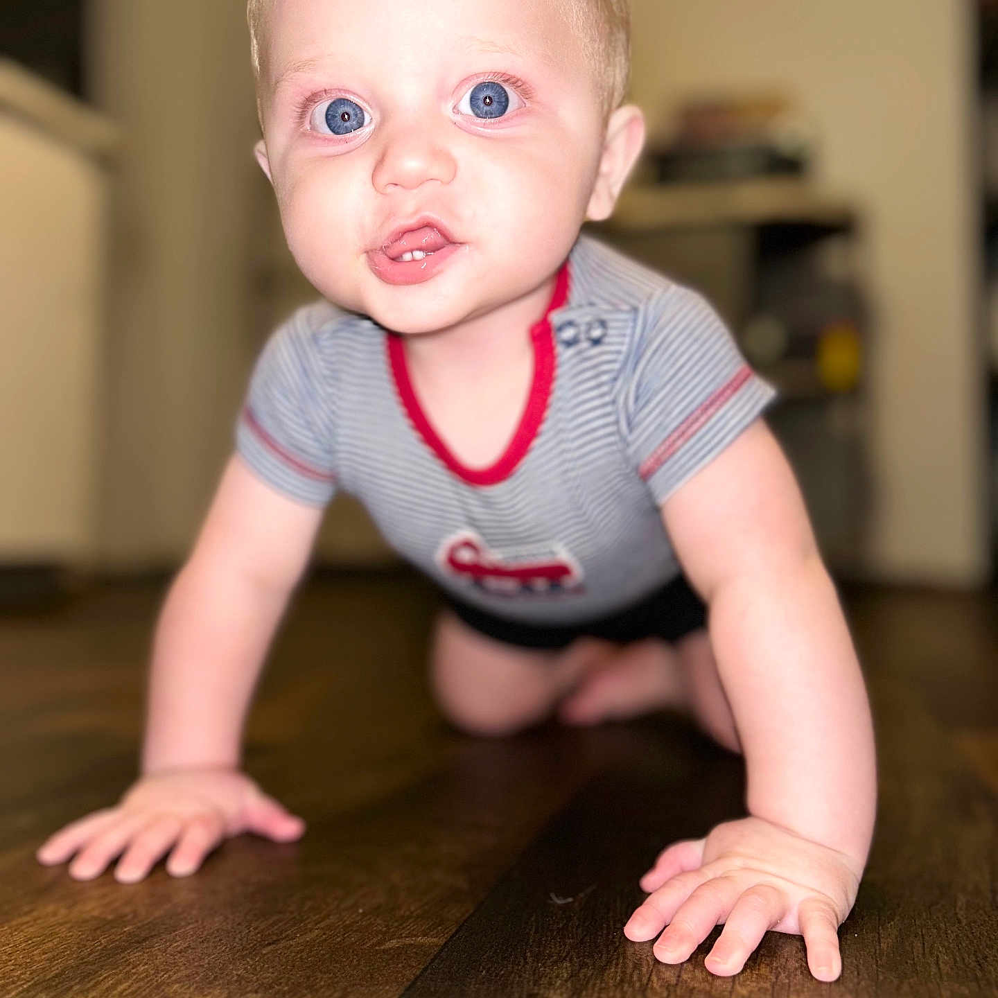 Noah joined the competition — help win amazing prizes! baby, blond_hair, blue_eyes, blurred_background, bright_eyes, child, close_up, crawling, cute, floor, happy, home, indoor, infant, person, portrait, small_hands, striped_shirt, toddler, wooden_floor