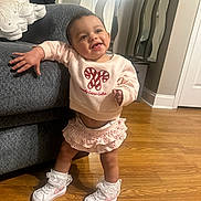 Leah joined the competition — help win amazing prizes! architecture, baby, building, clothing, couch, face, footwear, furniture, hardwood, head, indoors, interiordesign, livingroom, person, photography, portrait, shoe, sitting, sneaker, wood