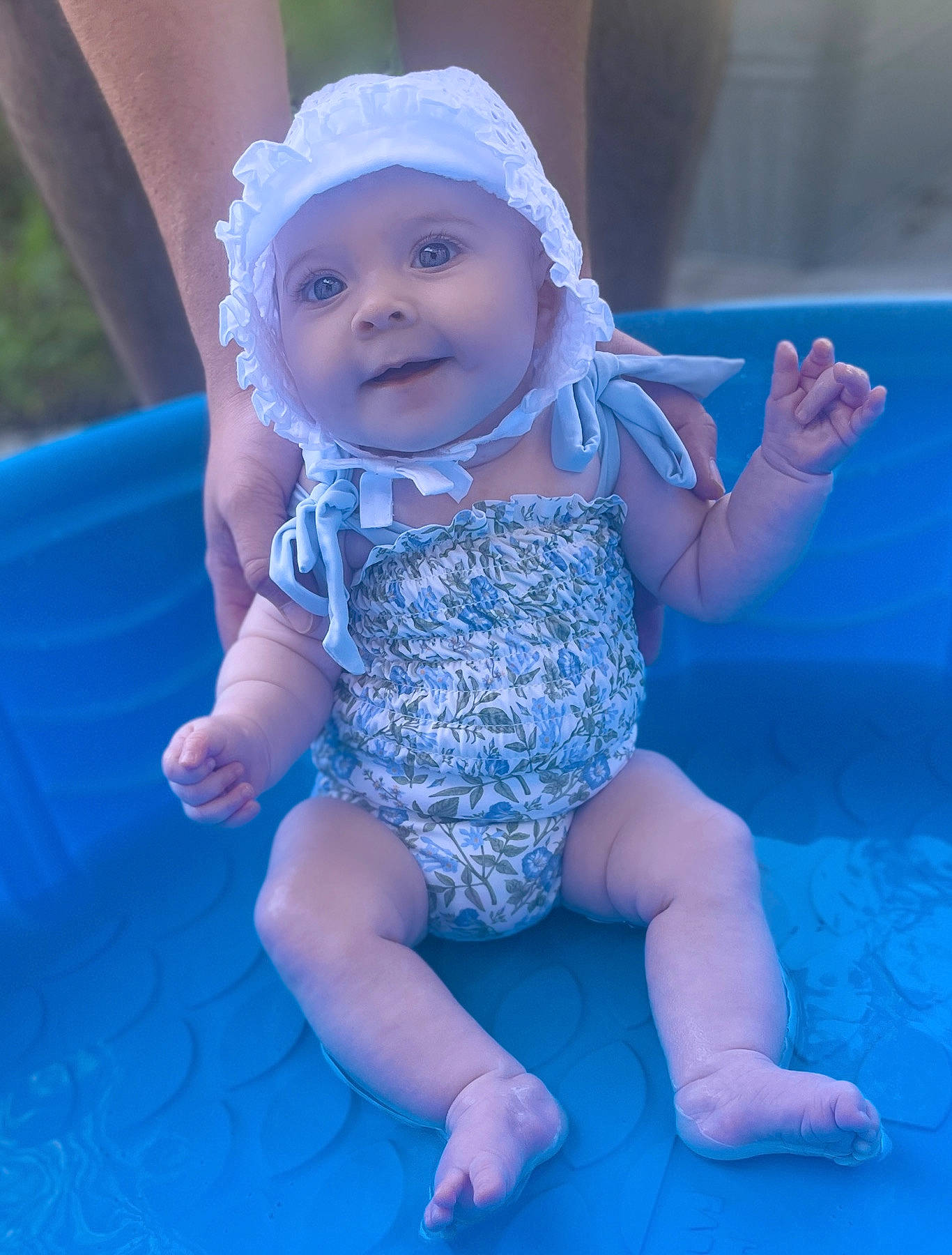 Mila is registered to the contest to win money with this photo: aqua, azure, baby, baby_toddler_clothing, electric_blue, eye, finger, fun, gesture, happy, headwear, human_body, leg, leisure, person, pink, purple, smile, thigh, thumb