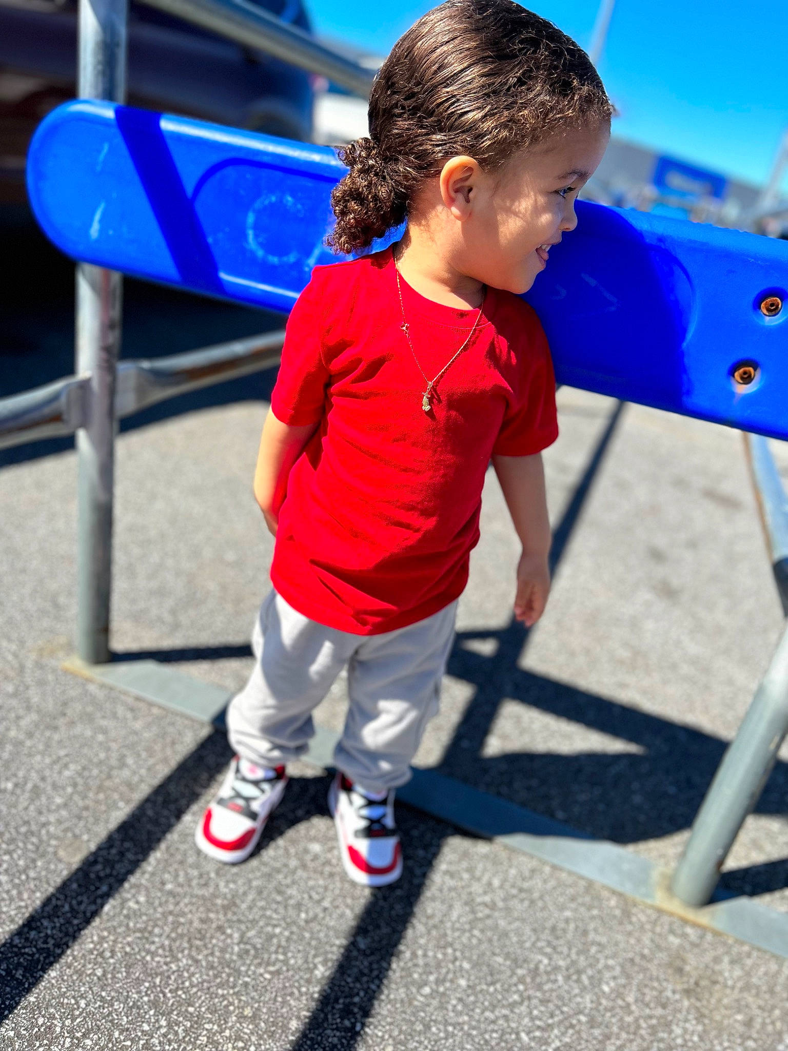 Jeremiah joined the competition — help win amazing prizes! blue, child, city, electric_blue, fun, games, happy, leisure, ocean, outdoor_play_equipment, person, personal_protective_equipment, play, playground_slide, recreation, shorts, sitting, sky, t_shirt, toddler