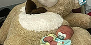 Lyam participe au concours pour gagner de l'argent avec cette photo : baby, ball, blanket, brush, couch, cushion, device, football, furniture, homedecor, person, plush, sleeping, soccer, soccerball, sport, teddybear, thermometer, tool, toy