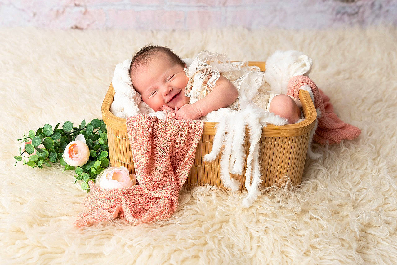 Luella joined the competition — help win amazing prizes! baby, baby_sleeping, baby_toddler_clothing, basket, comfort, costume_hat, flower, grass, hair_accessory, happy, hat, headpiece, linens, people_in_nature, person, petal, plant, sun_hat, textile, toddler