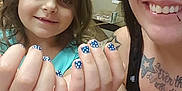 Paige joined the competition — help win amazing prizes! child, adult, nail_polish, blue_nails, polka_dots, smile, tattoos, piercings, indoor, person, face, hand, fingernails, happy, casual_clothing, closeup, family, fun, showing_hands, portrait