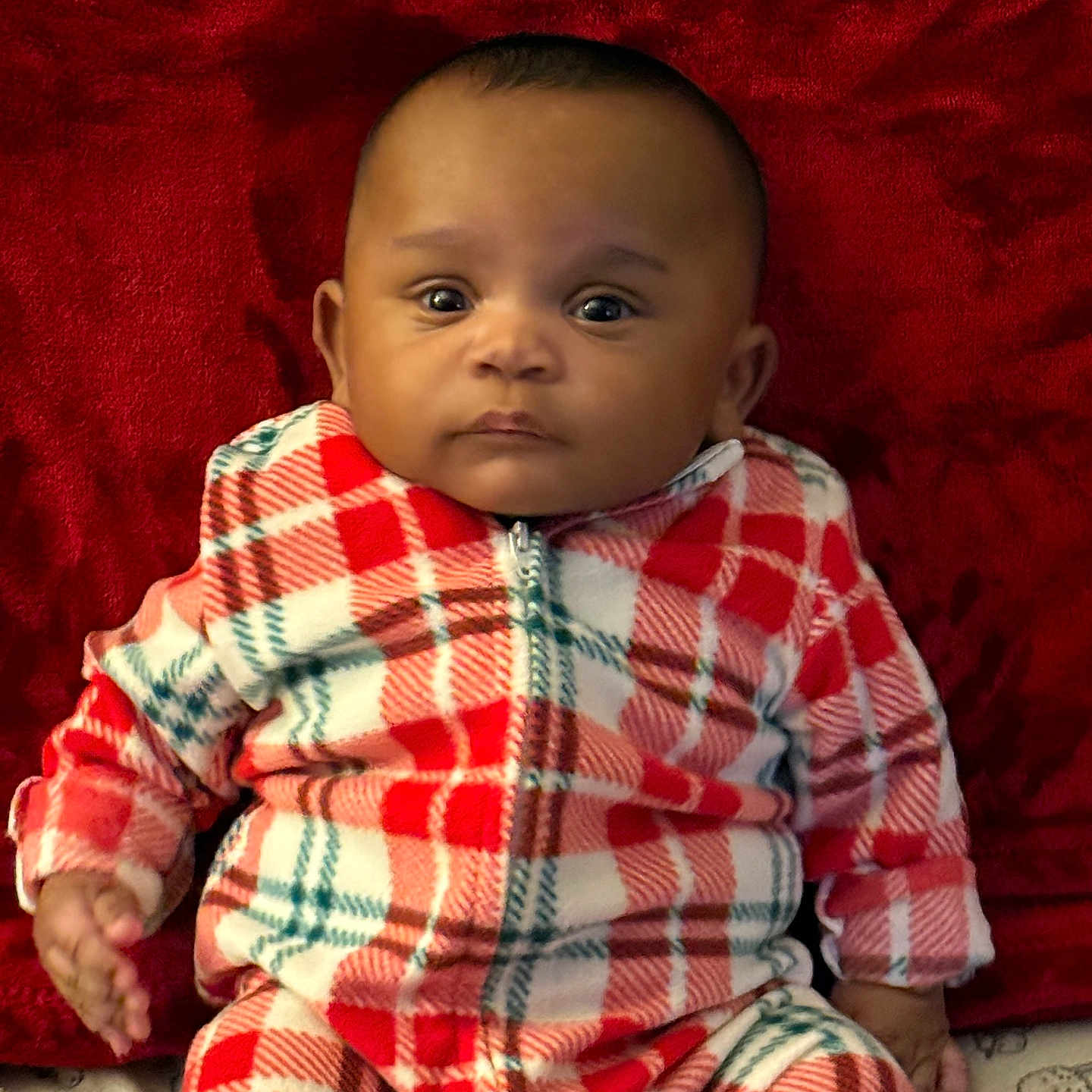 Dontay joined the competition — help win amazing prizes! baby, blanket, child, clothing, cozy, cute, cute_baby, expression, face, indoor, infant, pajamas, person, plaid, portrait, red, sitting, soft, white, young