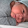 newborn, baby, infant, sleeping, grey_clothing, hat, closeup, face, skin, resting, cute, cozy, portrait, child, young, peaceful, soft, blanket, lying_down, indoors