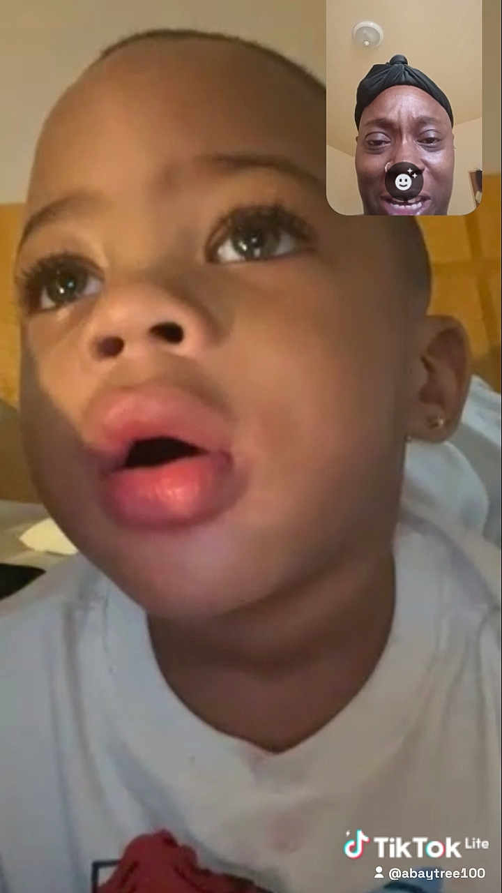 Za'Marii is registered to the contest to win money with this photo: child, face, closeup, video_call, adult, expression, indoor, person, head, communication, technology, screen, home, portrait, casual, white_clothing, earring, emotion, interaction, conversation