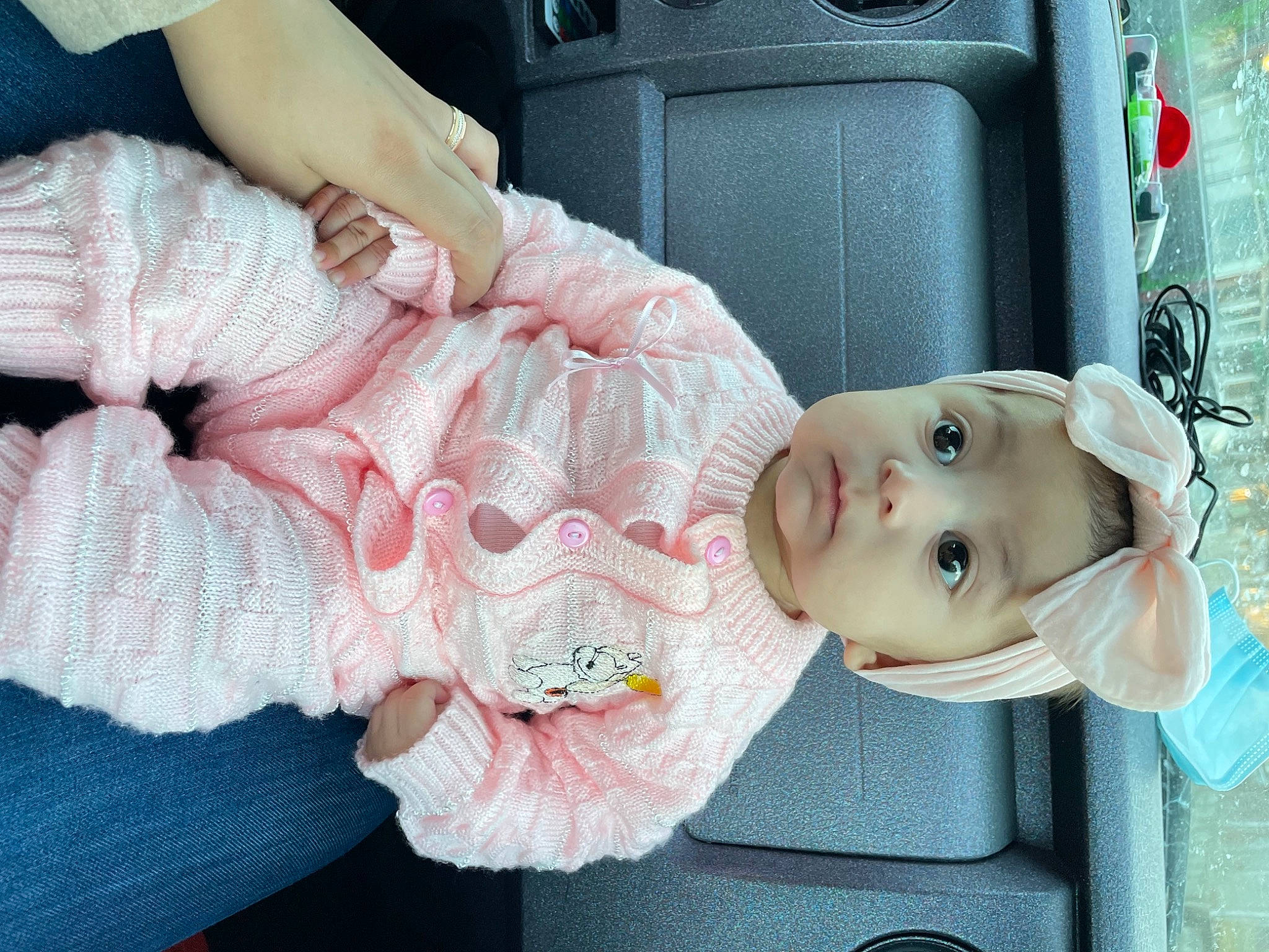 Addalyn joined the competition — help win amazing prizes! baby, baby_products, baby_toddler_clothing, bag, car_seat, child, doll, fashion_accessory, headgear, pattern, peach, person, pink, sitting, skin, suitcase, thread, toddler, toy, vehicle_door