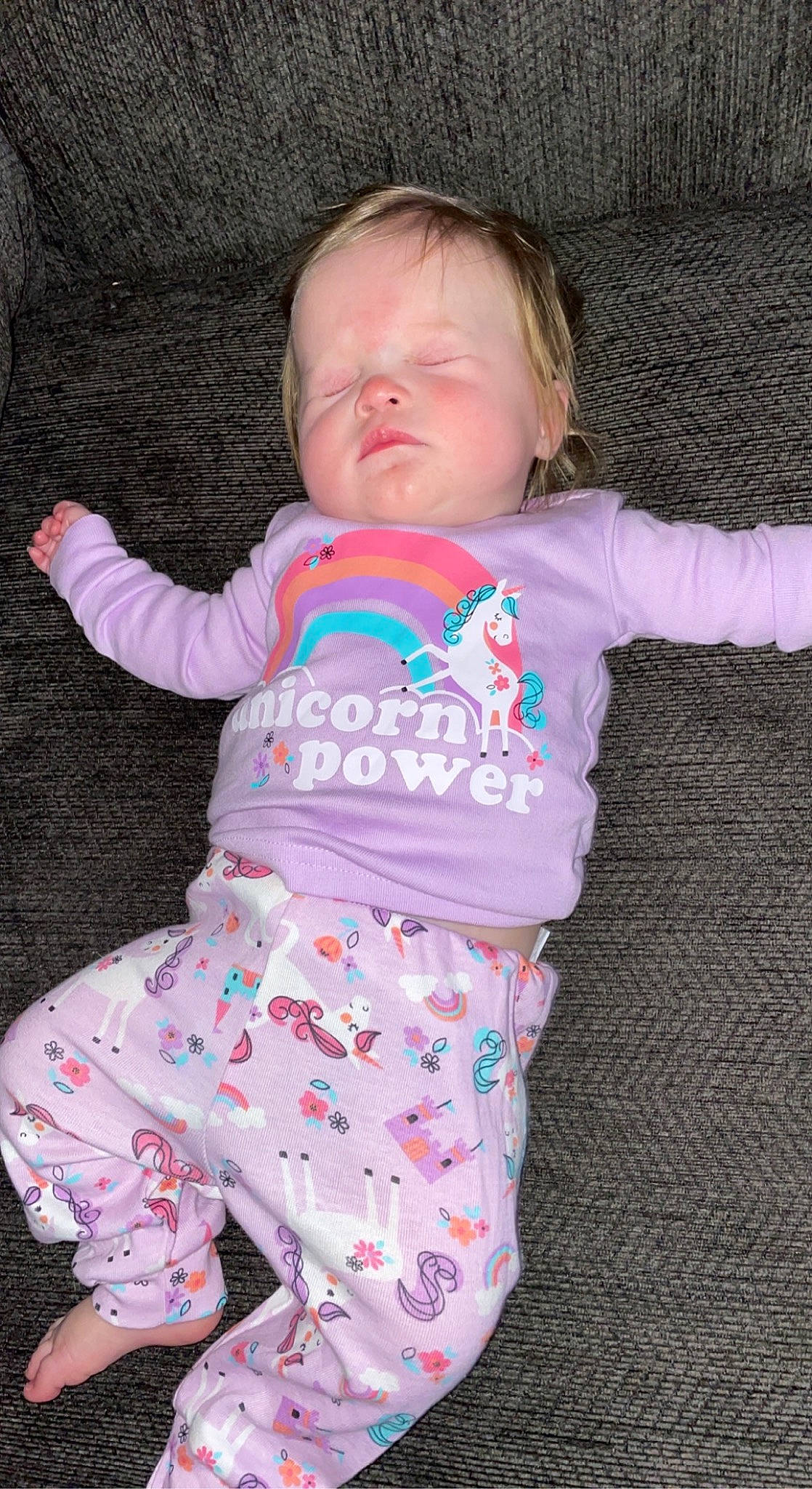 Maleah is registered to the contest to win money with this photo: arm, baby, baby_toddler_clothing, cheek, child, comfort, eye, finger, head, linens, magenta, nose, organ, pattern, person, pink, sitting, skin, sleeve, t_shirt