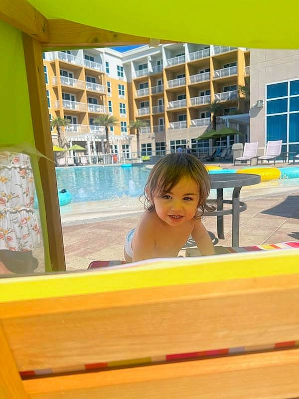 Luna-ray is registered to the contest to win money with this photo: bathing, building, child, condominium, flooring, fun, glass, house, joy, leisure, person, play, recreation, room, smile, swimming_pool, swimwear, table, toddler, vacation