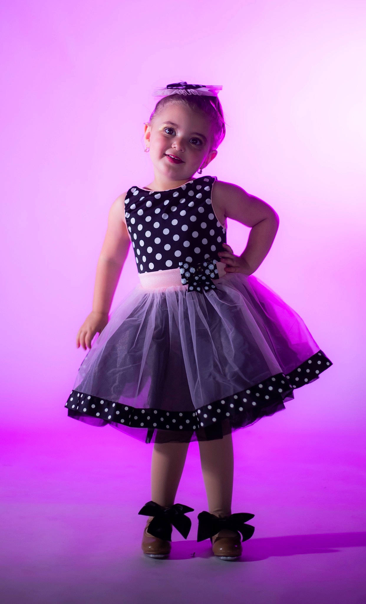 Caterina is registered to the contest to win money with this photo: arm, baby_toddler_clothing, day_dress, dress, electric_blue, entertainment, fashion_design, flash_photography, hair, human_body, joy, magenta, one_piece_garment, pattern, person, pink, purple, shoulder, sleeve, toddler