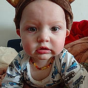 Brayden a rejoint le concours — aidez-le/la à gagner de superbes lots ! baby, child, face, hat, bear_ears, necklace, beads, clothing, long_sleeve, pattern, vehicles, blanket, indoor, portrait, closeup, cute, expression, infant, person, young