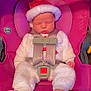baby, infant, sleeping, car_seat, pink, holiday_hat, santa_hat, white_clothing, cute, child, straps, safety_harness, foot, indoor, seat, adorable, peaceful, newborn, soft_texture, holiday