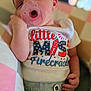 baby, infant, pacifier, sleeping, headband, clothing, shirt, denim_shorts, hand, face, person, cute, resting, indoors, soft_light, blurred_background, patriotic, stars, firecracker, child
