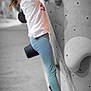 child, girl, climbing, rock_wall, glasses, indoor, sport, active, young, smile, leggings, tshirt, shoes, focus, exercise, fun, challenge, background_blur, indoor_sport, determined