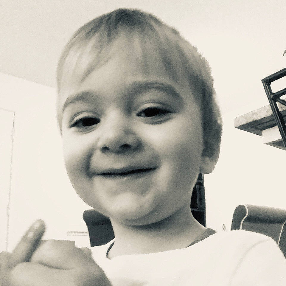 Leroy is registered to the contest to win money with this photo: black_and_white, cheek, child, chin, ear, eye, eyebrow, face, facial_expression, forehead, hair, hairstyle, head, joy, lip, nose, people, person, photograph, skin