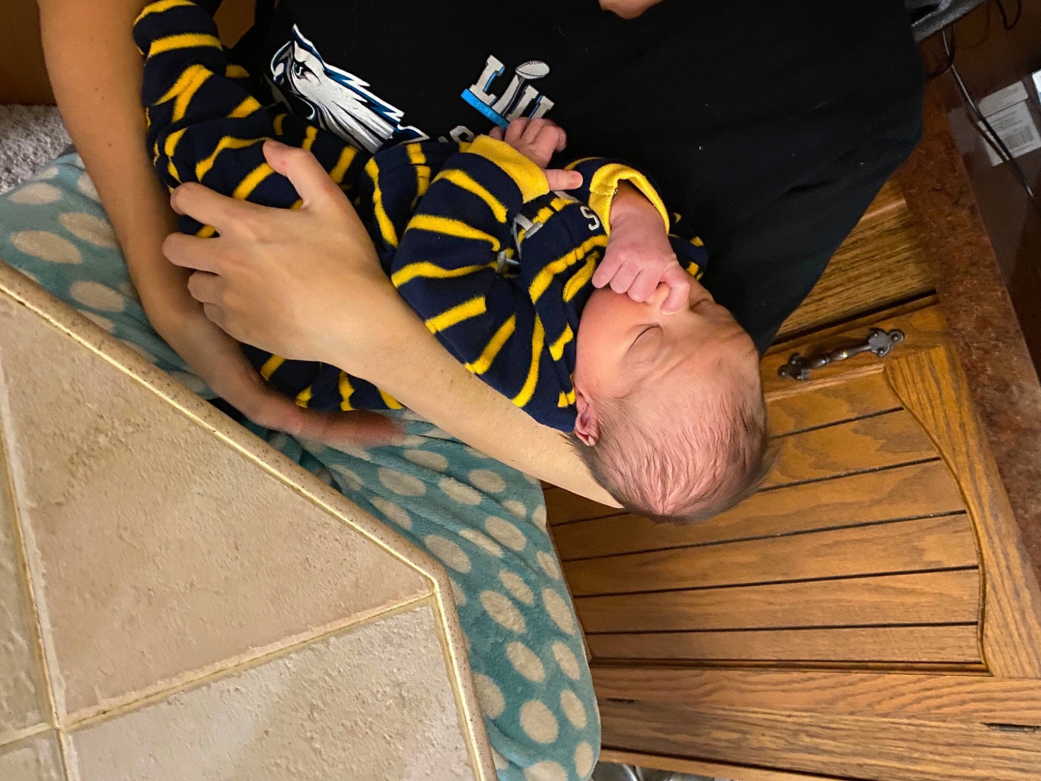 Walter joined the competition — help win amazing prizes! ankle, bracelet, foot, hardwood, lap, nail, person, plank, sandal, toe, wood_stain, wrist