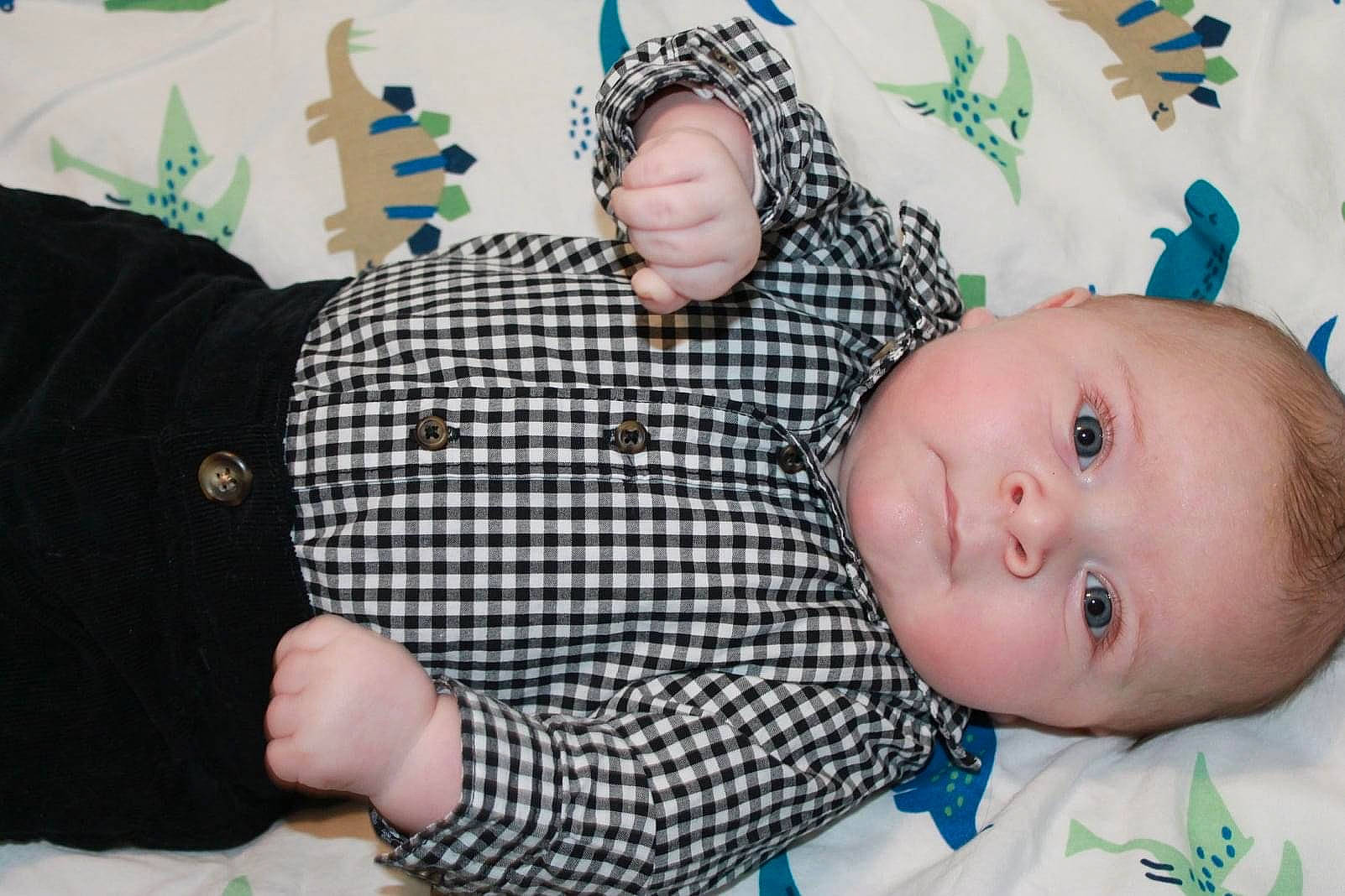 Colin is registered to the contest to win money with this photo: baby, baby_products, baby_toddler_clothing, button, cheek, finger, iris, linens, lip, nail, pattern, person, skin, thumb