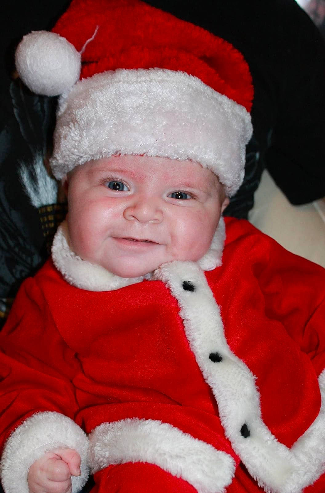 Colin joined the competition — help win amazing prizes! baby, baby_toddler_clothing, cheek, child, christmas, christmas_eve, costume_accessory, costume_hat, facial_expression, fictional_character, fur, fur_clothing, happy, headwear, holiday, joy, person, pleased, red, skin