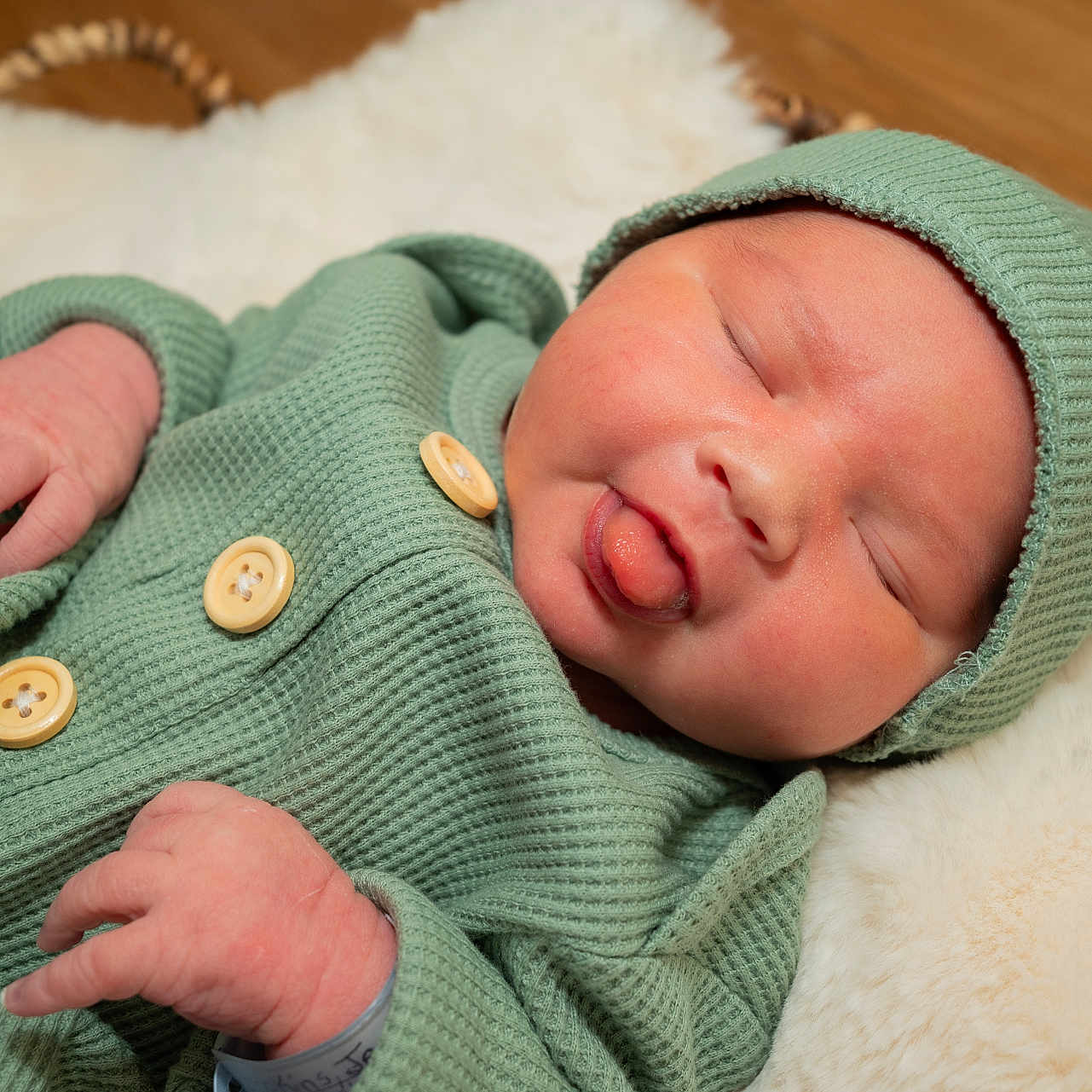 Sawyer is registered to the contest to win money with this photo: baby, beanie, blanket, bodypart, bonnet, cap, clothing, face, finger, hand, hat, head, hoodie, knitwear, newborn, person, photography, portrait, sweater, sweatshirt