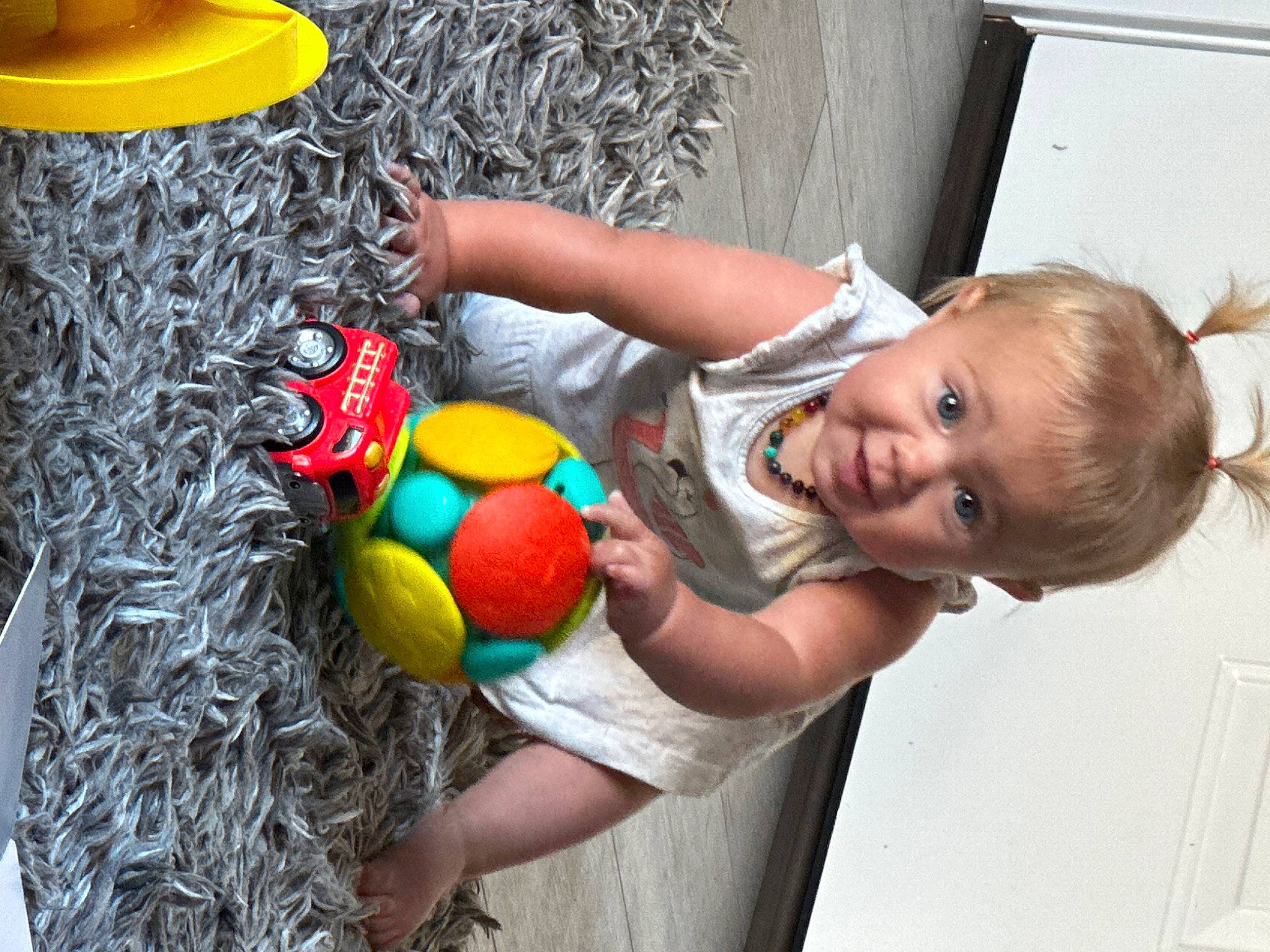 Rayleigh is registered to the contest to win money with this photo: baby, baby_products, baby_toddler_clothing, ball, child, fun, happy, holiday, leisure, party_supply, people_in_nature, person, play, smile, t_shirt, toddler, toy, tree, world