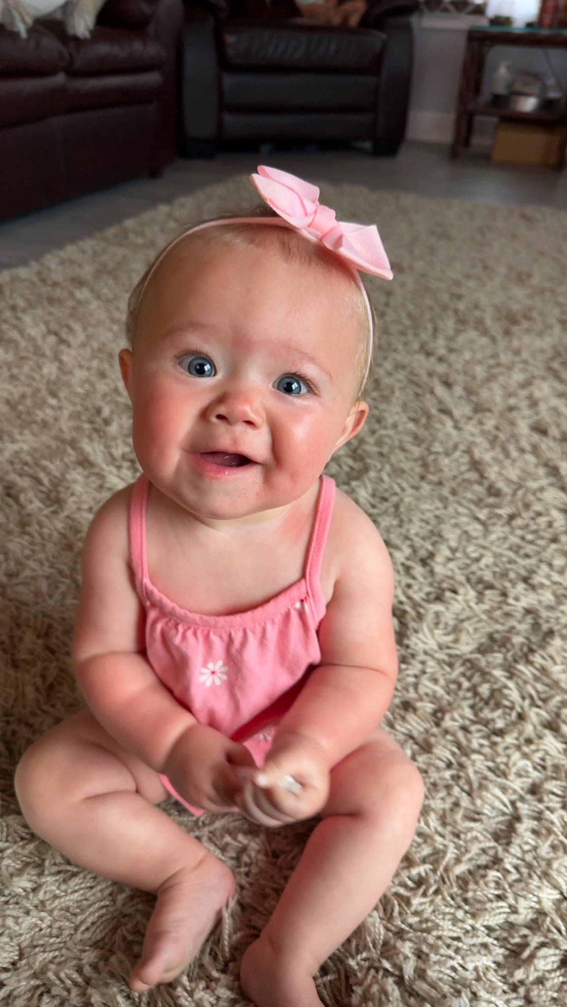 Rayleigh is registered to the contest to win money with this photo: baby, baby_toddler_clothing, cheek, chin, eye, face, finger, fun, grass, happy, head, iris, lip, mouth, nose, person, pink, skin, sleeve, smile