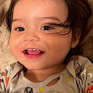 Alexander is registered to the contest to win money with this photo: animal_print, baby, child, clothing, cute, eyes, face, hair, halloween, happy, indoors, infant, onesie, portrait, pumpkin, skeleton, smiling, teeth, toddler, young_child