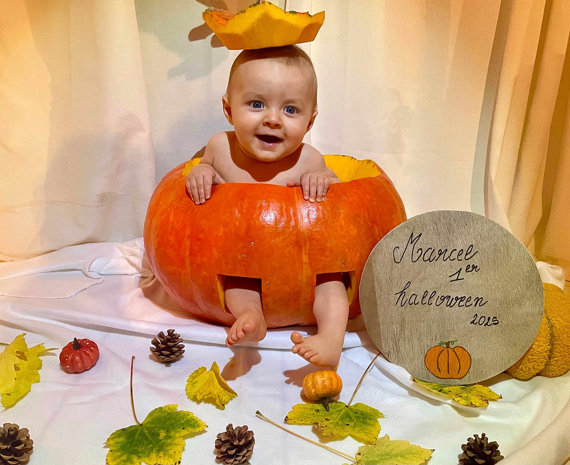 Marcel participe au concours pour gagner de l'argent avec cette photo : baby, pumpkin, halloween, fall, autumn, leaves, pinecones, orange, smiling, child, cute, decor, festive, holiday, portrait, indoor, costume, seasonal, sign, celebration