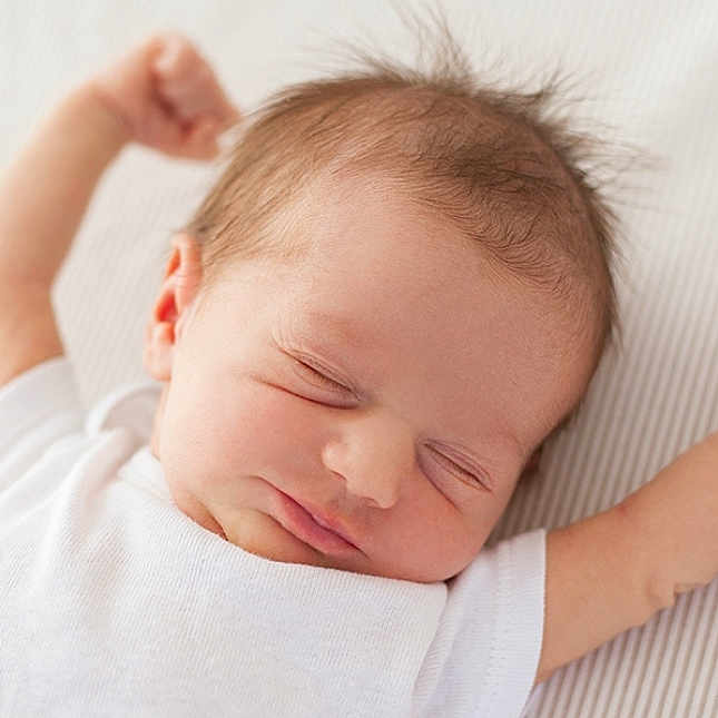 Bibi is registered to the contest to win money with this photo: arms_up, baby, child, closeup, cute, expression, face, head, human, infant, newborn, peaceful, portrait, resting, skin, sleeping, small_hands, soft_surface, stretching, white_onesie