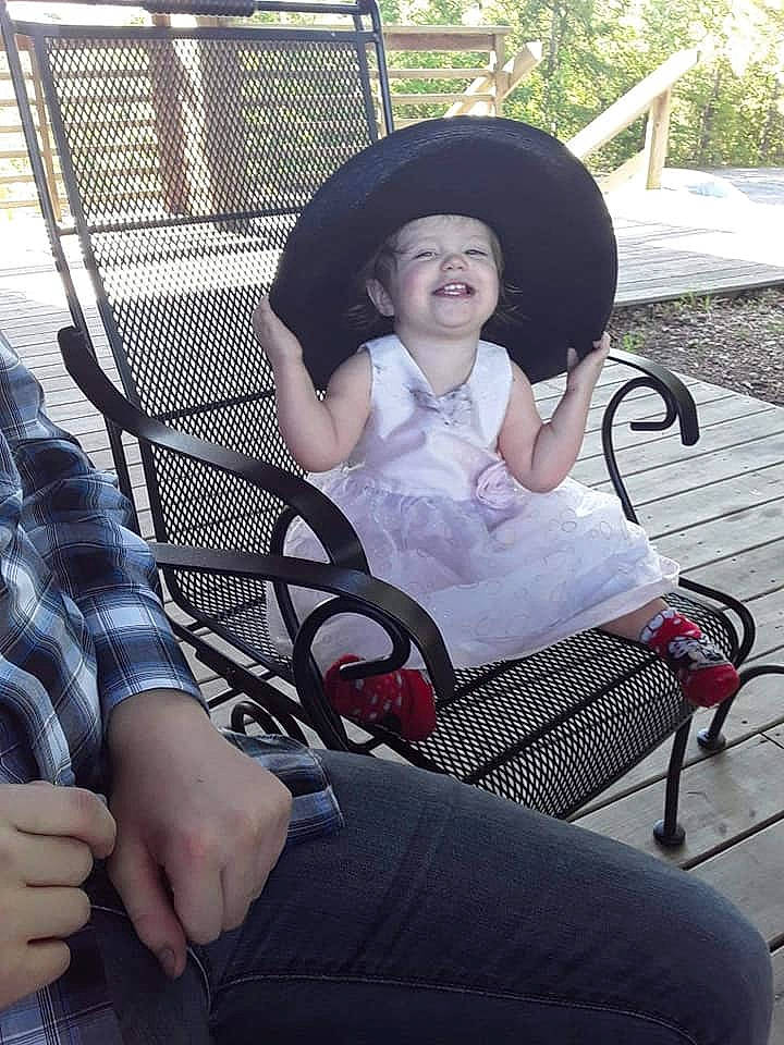 Roselynn joined the competition — help win amazing prizes! baby_carriage, black_hair, chair, comfort, fun, grass, hairstyle, hand, hat, headwear, human_leg, joy, knee, lap, leg, leisure, person, plant, sitting, smile