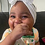 Savani Sage joined the competition — help win amazing prizes! baby, headband, bow, smiling, hand, face, clothing, orange_pattern, couch, happy, child, indoors, cute, closeup, infant, portrait, playful, young, person, bright